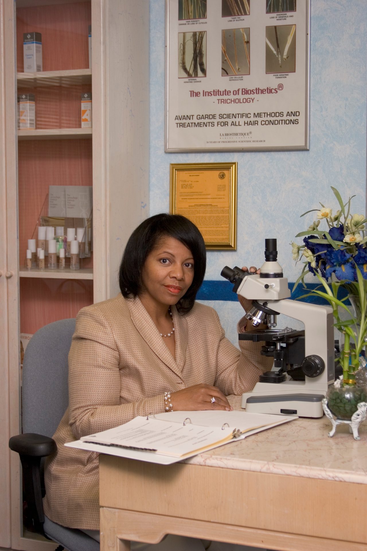 African American Woman At A Microscope