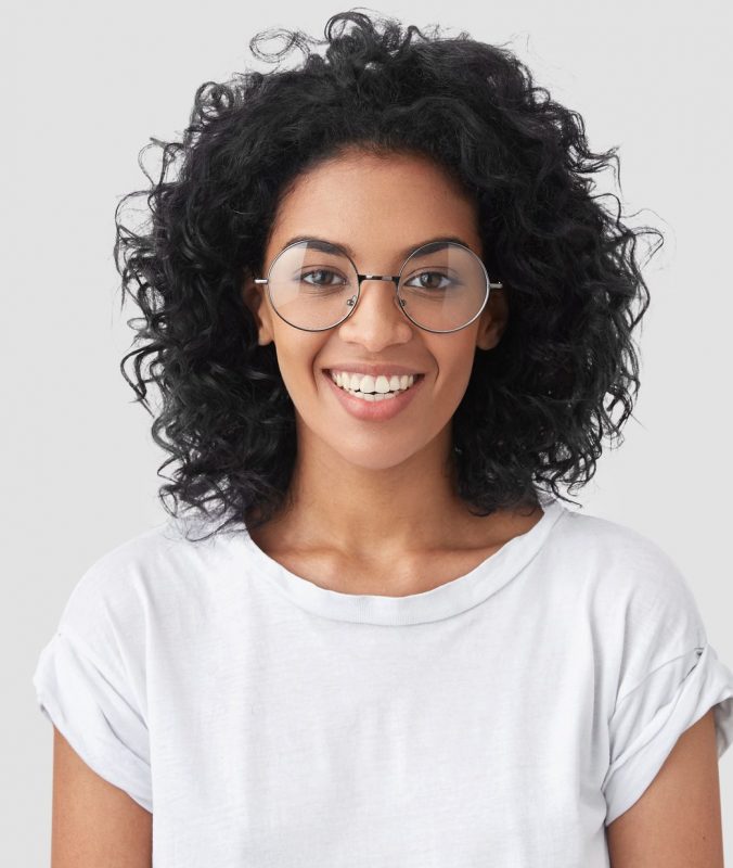Woman In Glasses With Curly Black Hair